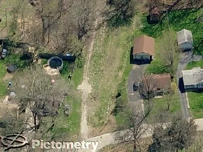 an aerial view of residential house with outdoor space