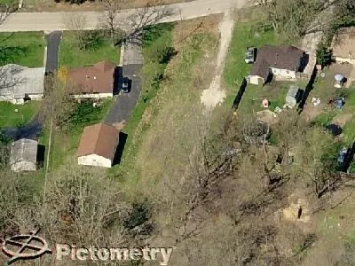 an aerial view of residential house with parking space