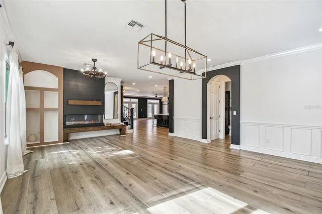 a large kitchen with lots of counter space and stainless steel appliances