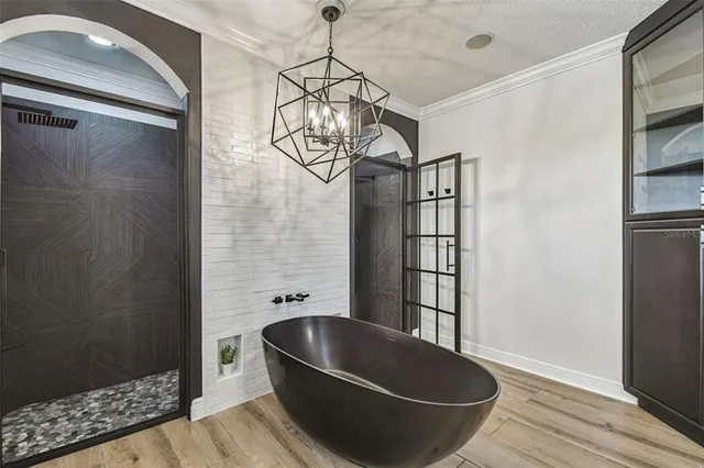 a spacious bathroom with a double vanity sink a toilet and a mirror