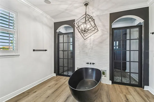 a close view of a sink a stove and storage in a kitchen