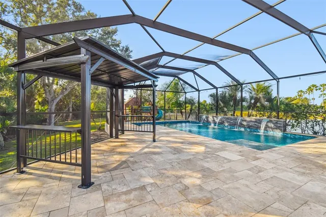 an aerial view of lake residential houses with outdoor space and seating area