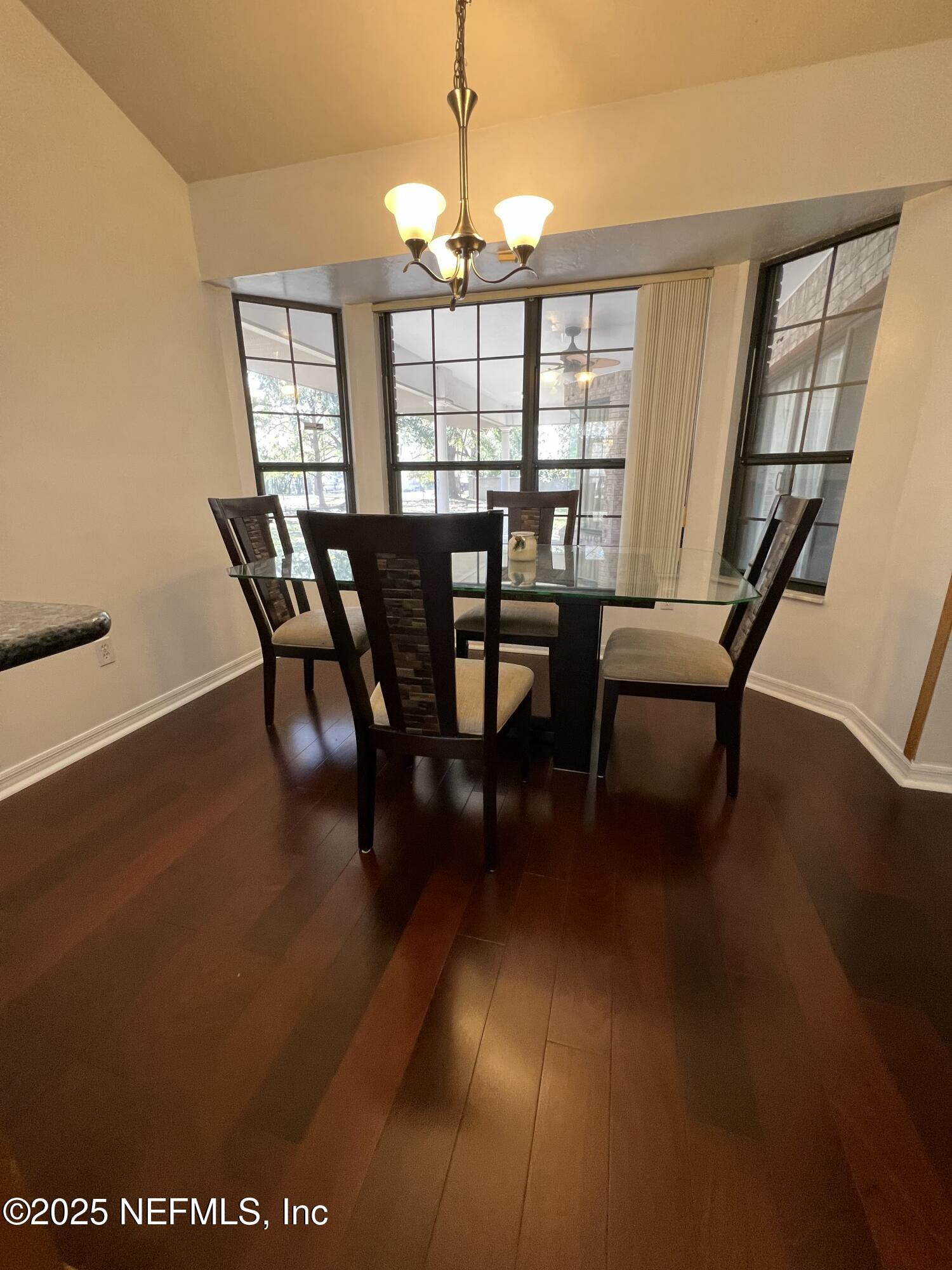 1825 Raiford Road Starke, FL 32091 - Photo 17 of 92 a view of a dining room with furniture window and wooden floor