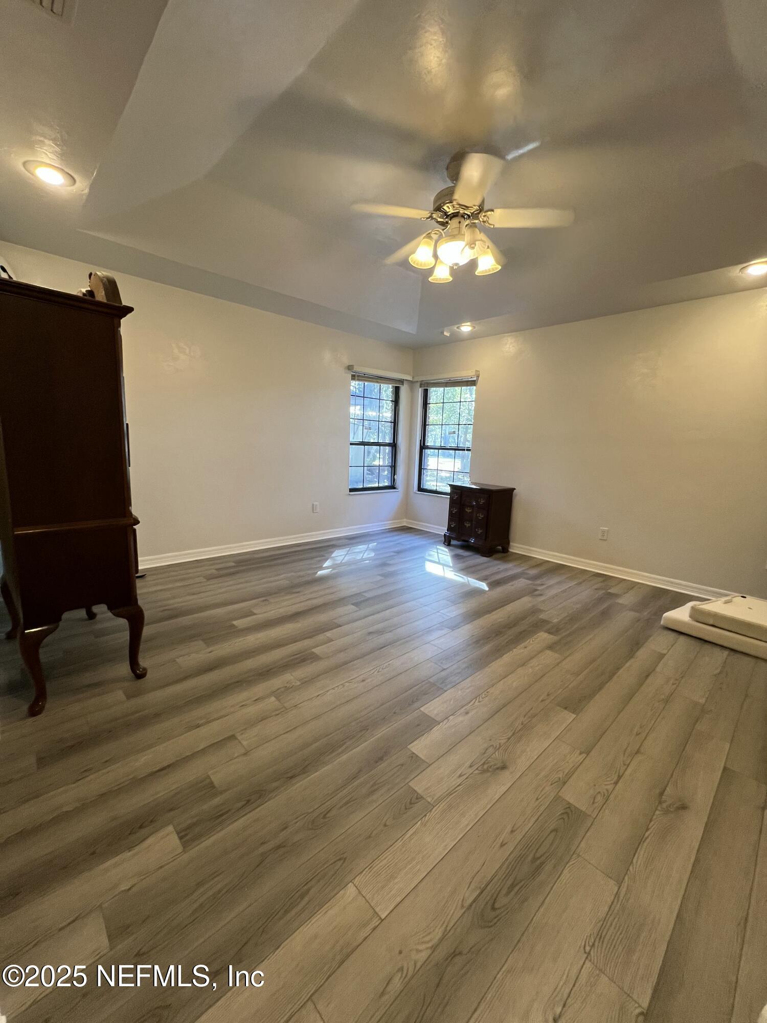 1825 Raiford Road Starke, FL 32091 - Photo 21 of 92 wooden floor in an empty room with a window
