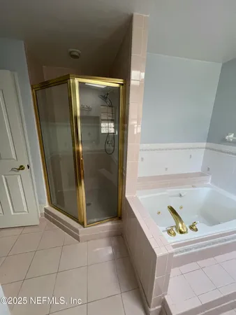 a bedroom with furniture and a ceiling fan