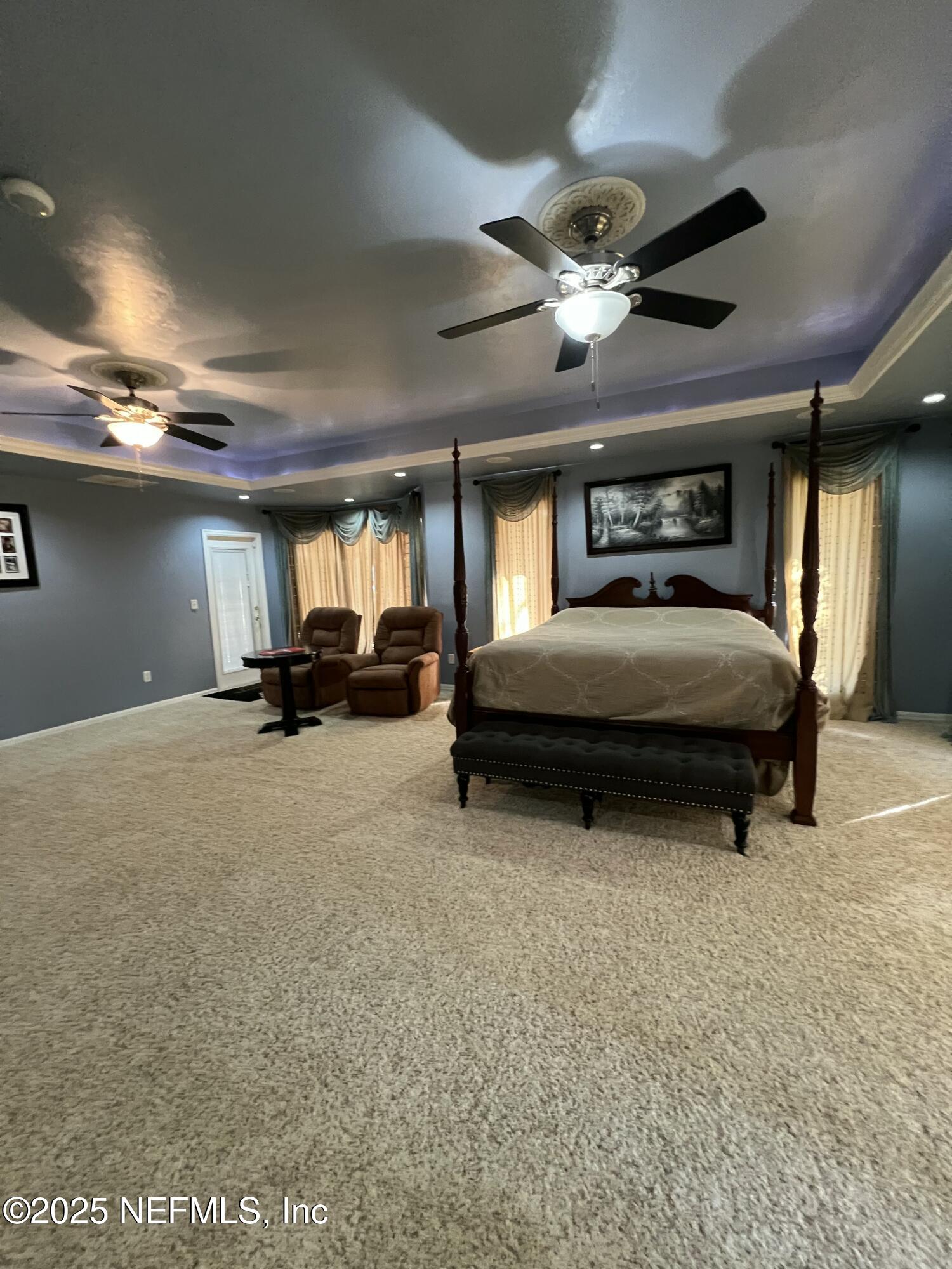 1825 Raiford Road Starke, FL 32091 - Photo 37 of 92 a bedroom with furniture and a ceiling fan