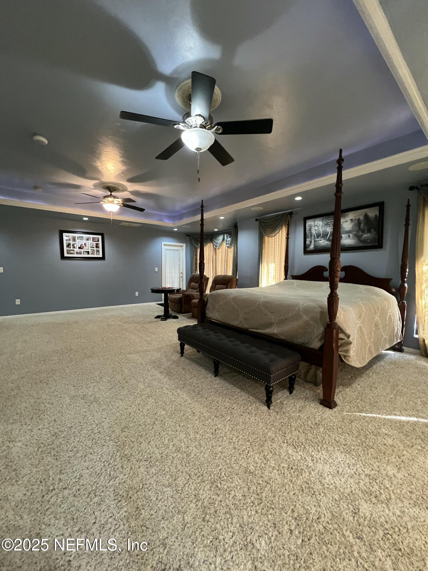 1825 Raiford Road Starke, FL 32091 - Photo 38 of 92 a bedroom with a bed and a ceiling fan