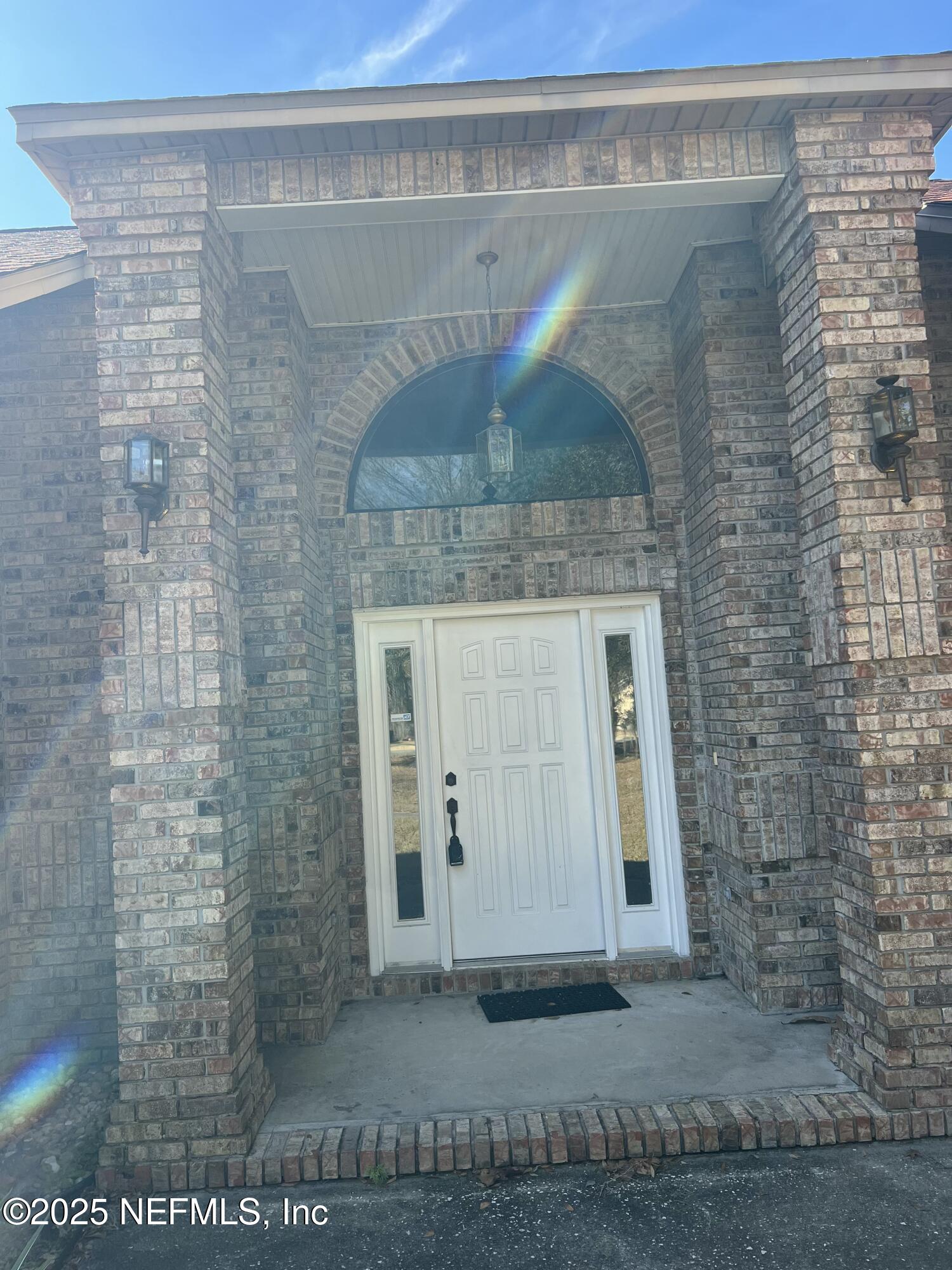 1825 Raiford Road Starke, FL 32091 - Photo 57 of 92 a bathroom with a granite countertop sink and a mirror