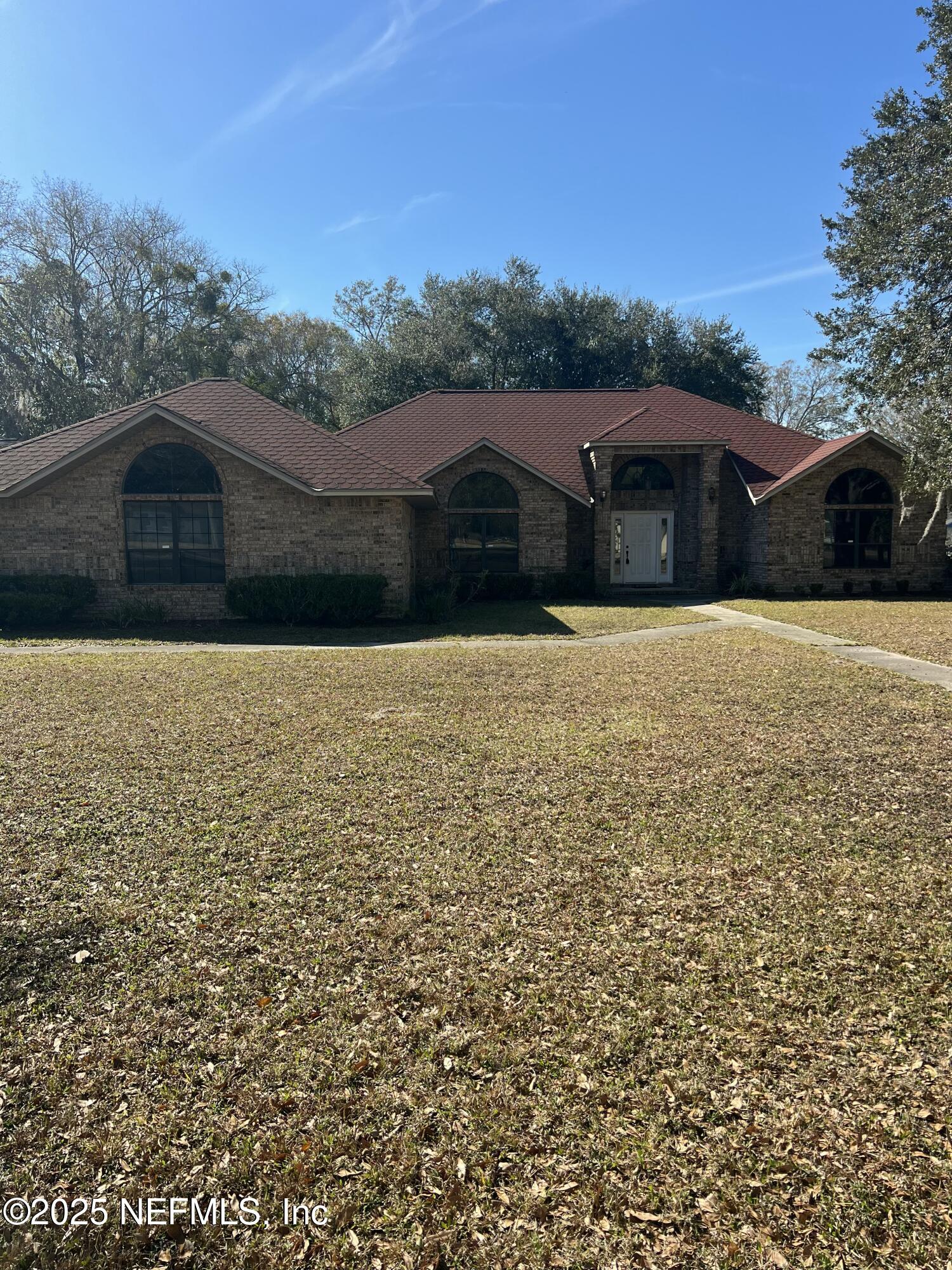1825 Raiford Road Starke, FL 32091 - Photo 63 of 92 a front view of a house with a yard