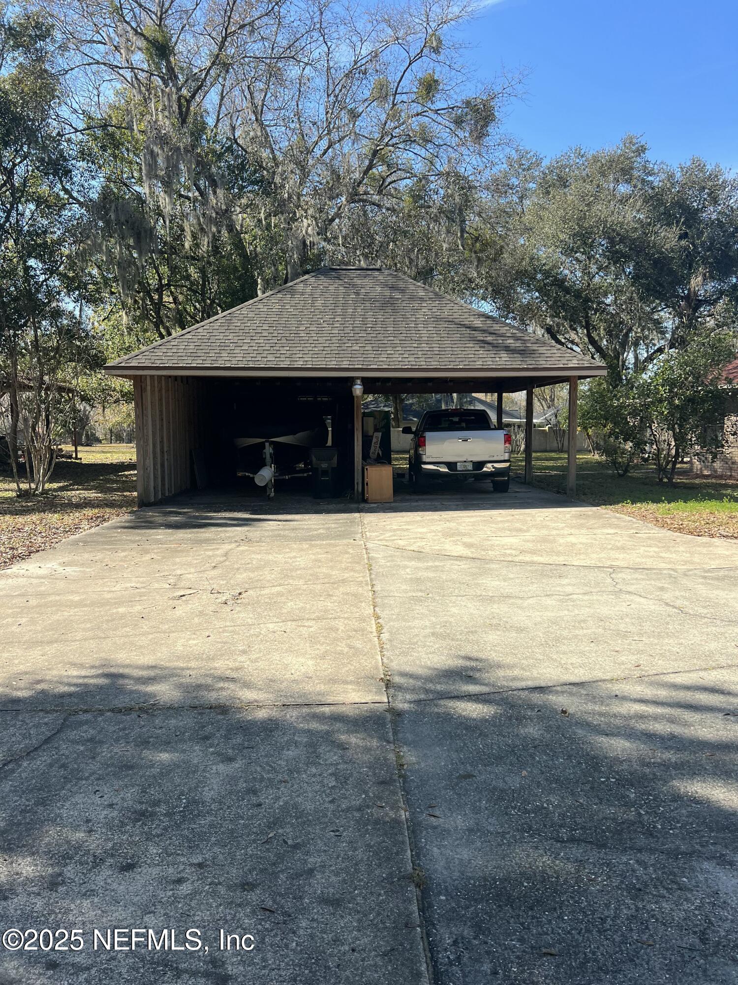 1825 Raiford Road Starke, FL 32091 - Photo 92 of 92 a view of house with yard and trees in the background