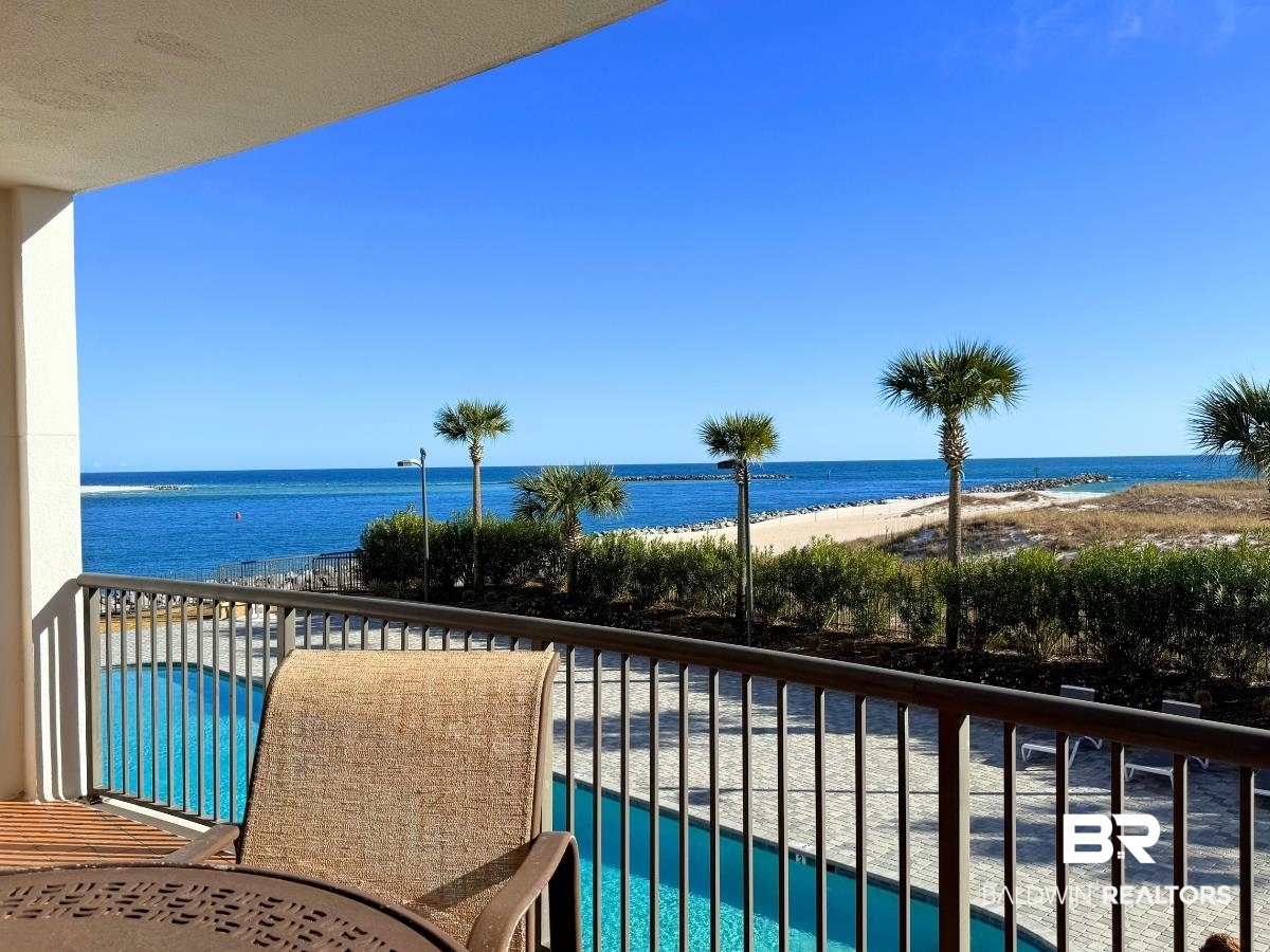 27284 Gulf Road, Unit 212 Orange Beach, AL 36561 - Photo 27 of 35 Balcony featuring view of pool area and view of water and beach