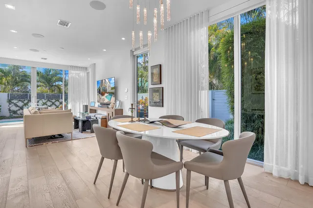 a bedroom with a large bed and a large window