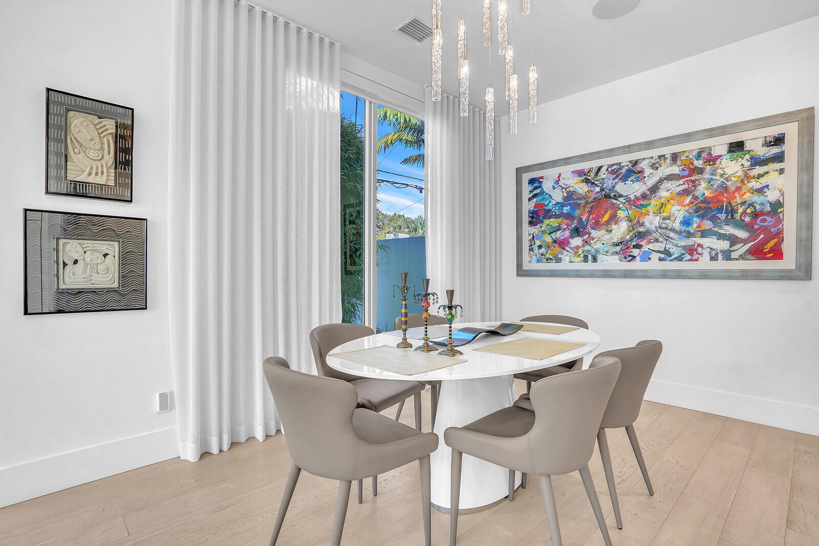 200 Northeast 7th Avenue, Unit 3 Delray Beach, FL 33483 - Photo 17 of 71 a view of a dining room with furniture a rug and a painting