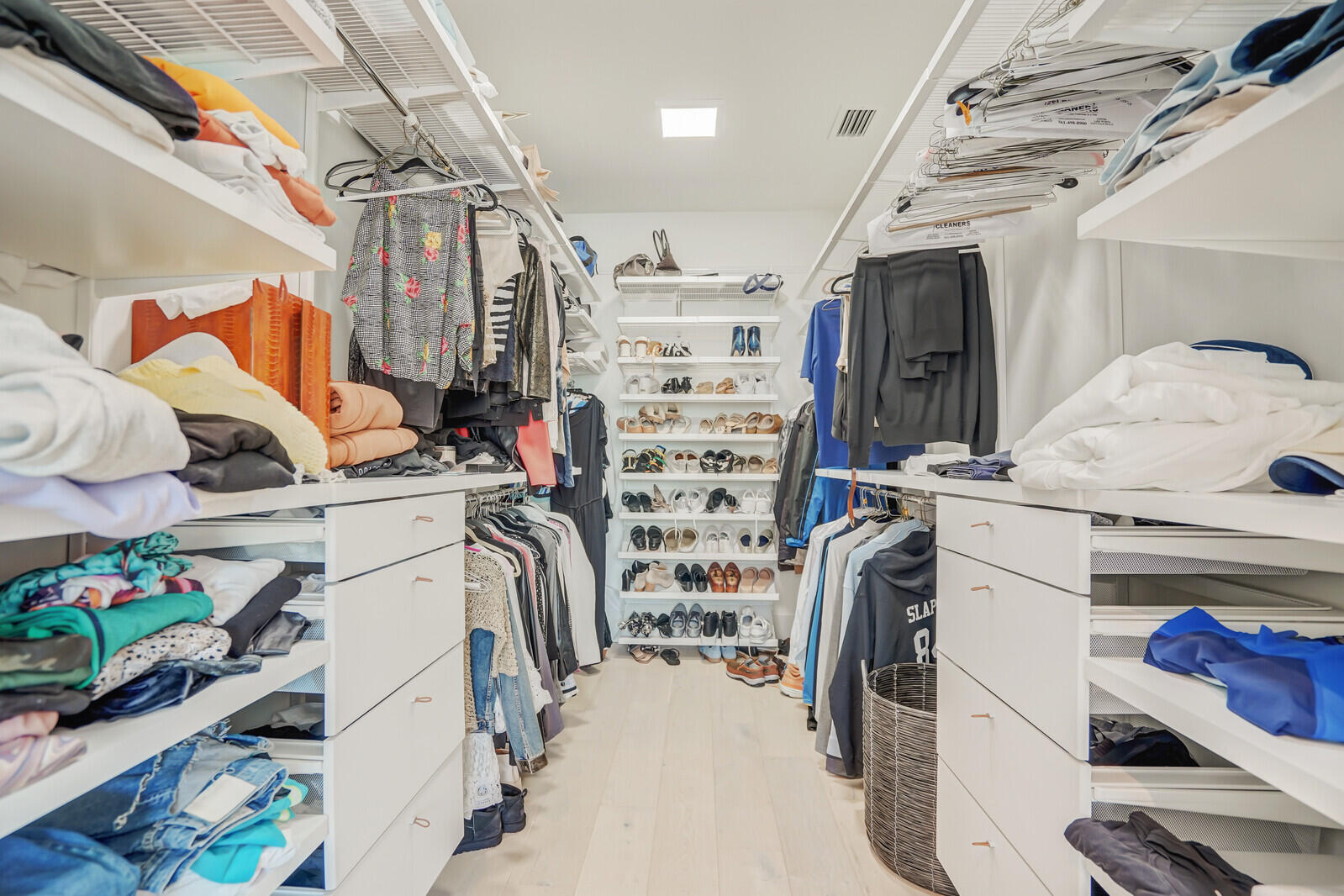 200 Northeast 7th Avenue, Unit 3 Delray Beach, FL 33483 - Photo 23 of 71 a view of walk in closet with clothes and shoes