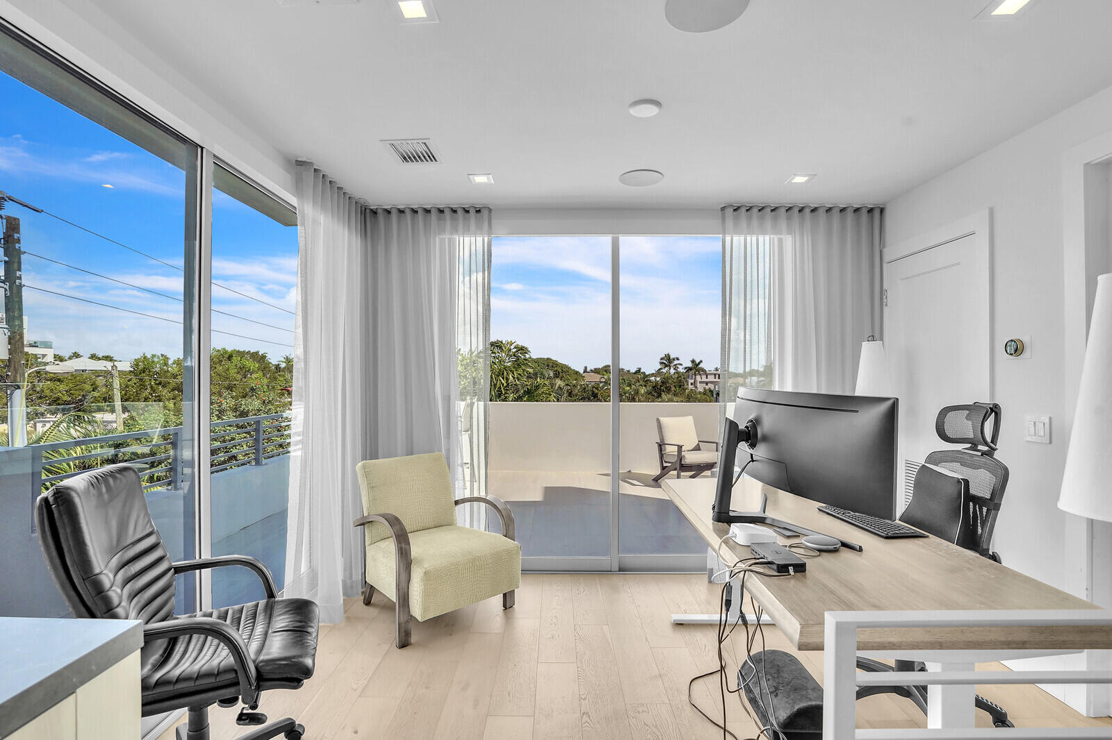 200 Northeast 7th Avenue, Unit 3 Delray Beach, FL 33483 - Photo 29 of 71 a living room with furniture and large windows