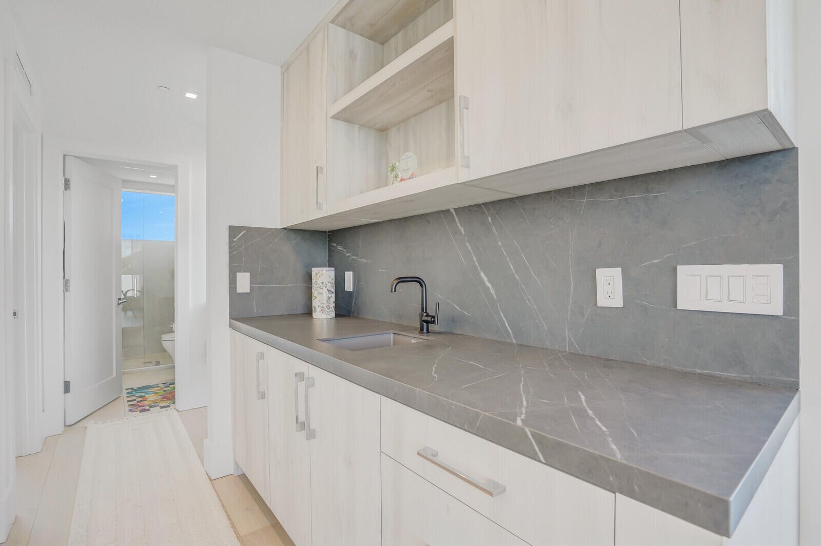 200 Northeast 7th Avenue, Unit 3 Delray Beach, FL 33483 - Photo 30 of 71 a kitchen with a sink and cabinets