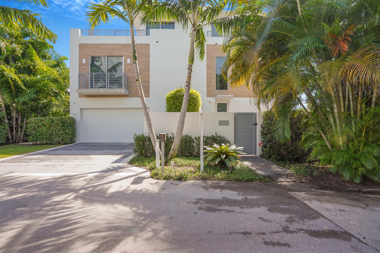 200 Northeast 7th Avenue, Unit 3 Delray Beach, FL 33483 - Photo 3 of 71 a view of house in front of a yard with potted plants