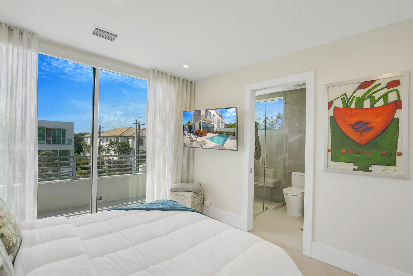 200 Northeast 7th Avenue, Unit 3 Delray Beach, FL 33483 - Photo 34 of 71 a bedroom with a bed and glass door