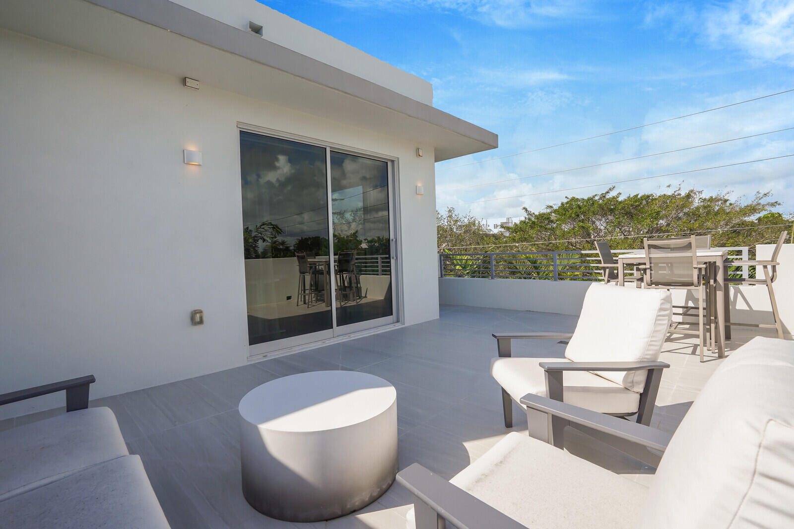 200 Northeast 7th Avenue, Unit 3 Delray Beach, FL 33483 - Photo 38 of 71 a view of a patio with couches chairs and a potted plant