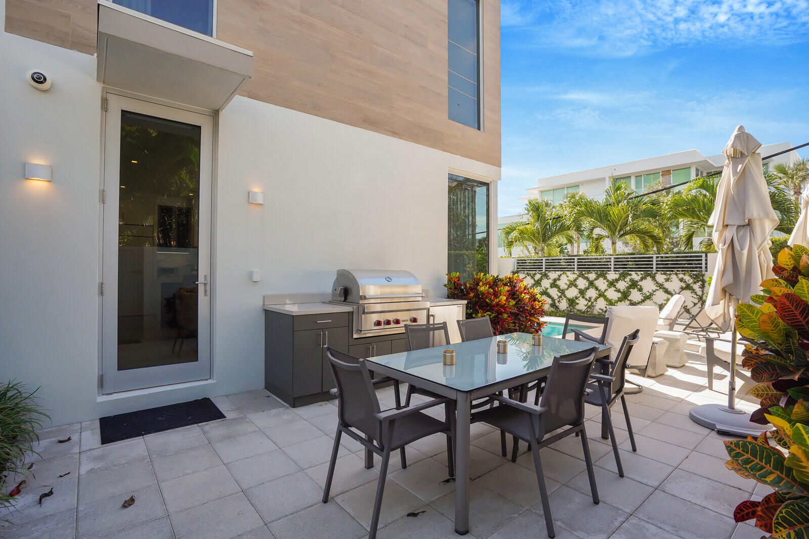 200 Northeast 7th Avenue, Unit 3 Delray Beach, FL 33483 - Photo 45 of 71 a view of outdoor dining space with a table and chairs