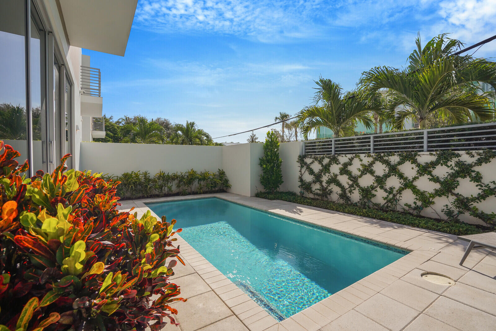 200 Northeast 7th Avenue, Unit 3 Delray Beach, FL 33483 - Photo 46 of 71 a view of a swimming pool with a yard