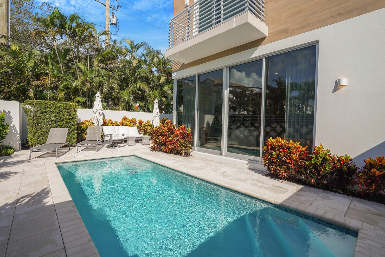 200 Northeast 7th Avenue, Unit 3 Delray Beach, FL 33483 - Photo 48 of 71 a view of a backyard with garden and patio