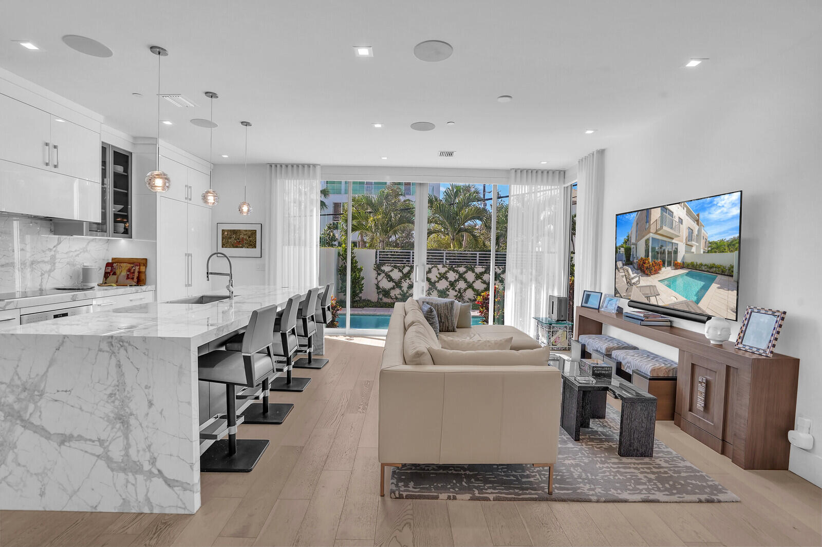 200 Northeast 7th Avenue, Unit 3 Delray Beach, FL 33483 - Photo 7 of 71 a large white kitchen with a large window and stainless steel appliances