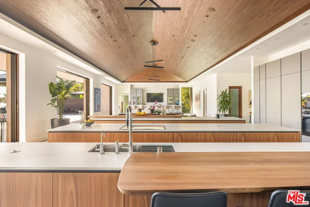 a kitchen with a sink and a refrigerator