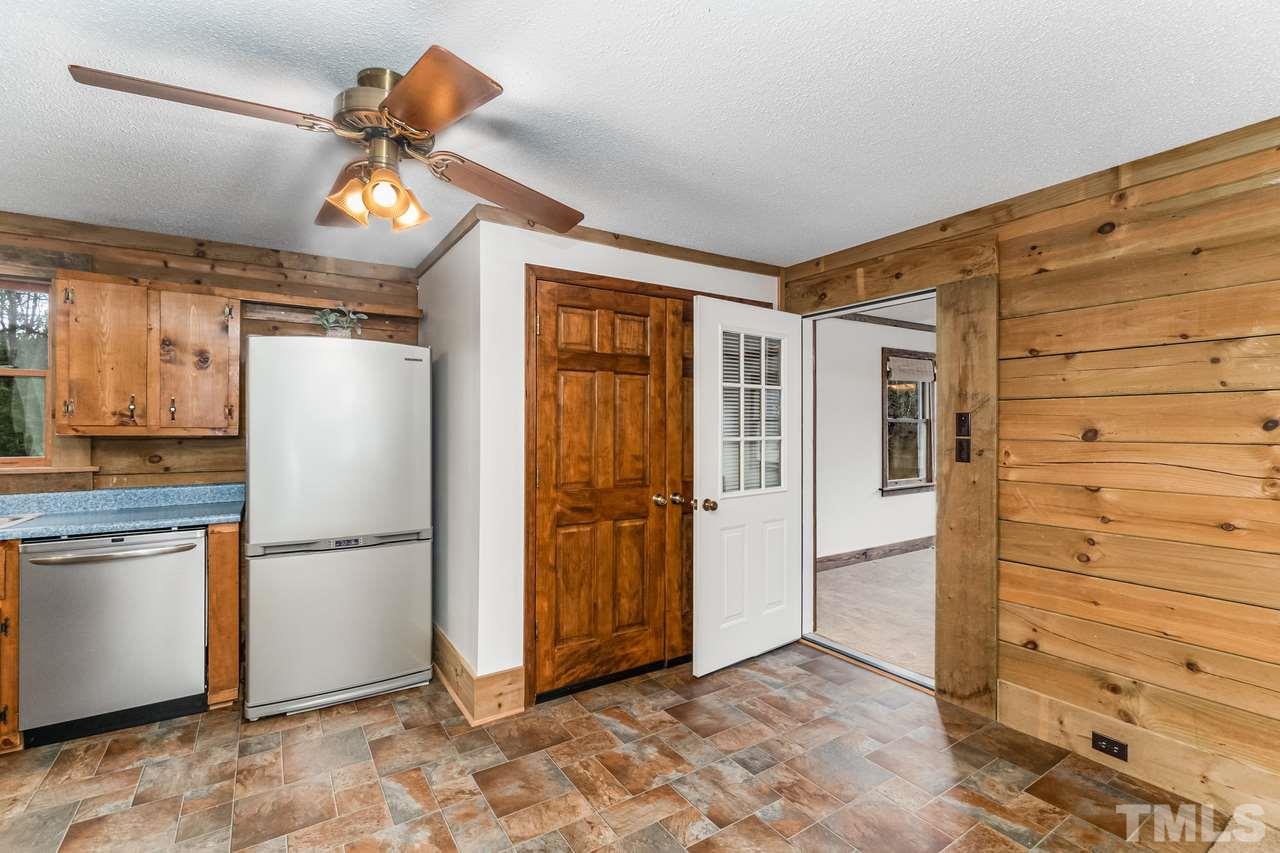 148 Nutbush Road Manson, NC 27553 - Photo 11 of 30 a view of a kitchen with a refrigerator and a stove top oven