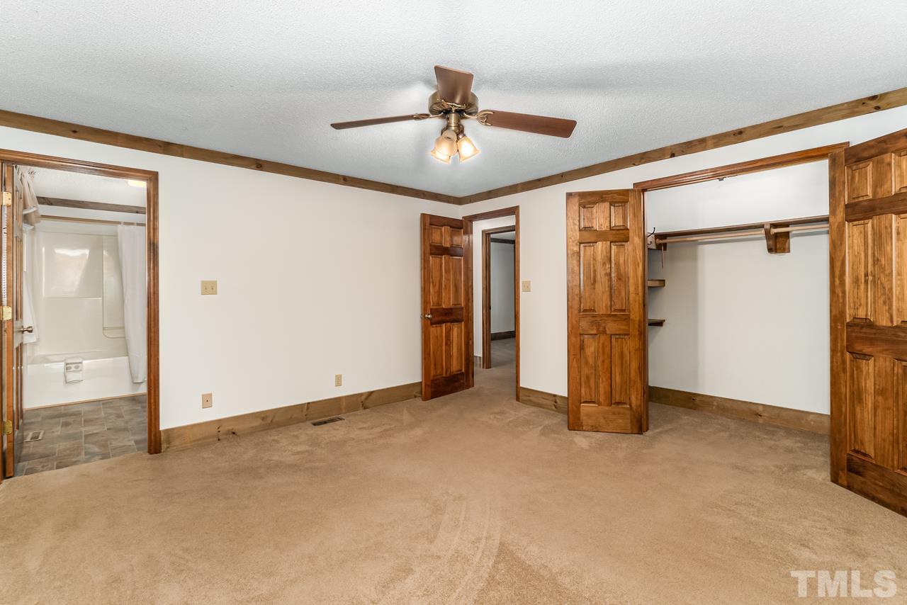 148 Nutbush Road Manson, NC 27553 - Photo 15 of 30 an empty room with closet and a ceiling fan
