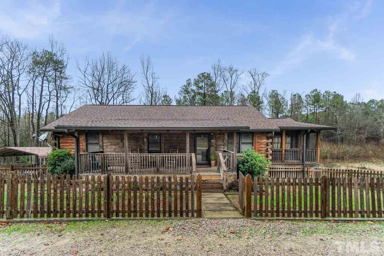 148 Nutbush Road Manson, NC 27553 - Photo 3 of 30 a front view of a house with a garden