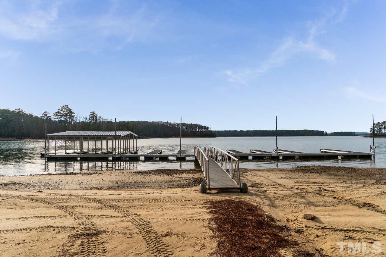 148 Nutbush Road Manson, NC 27553 - Photo 29 of 30 a view of a lake with boats and trees in the background
