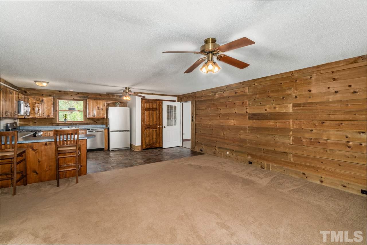 148 Nutbush Road Manson, NC 27553 - Photo 9 of 30 a view of a livingroom with furniture and a ceiling fan