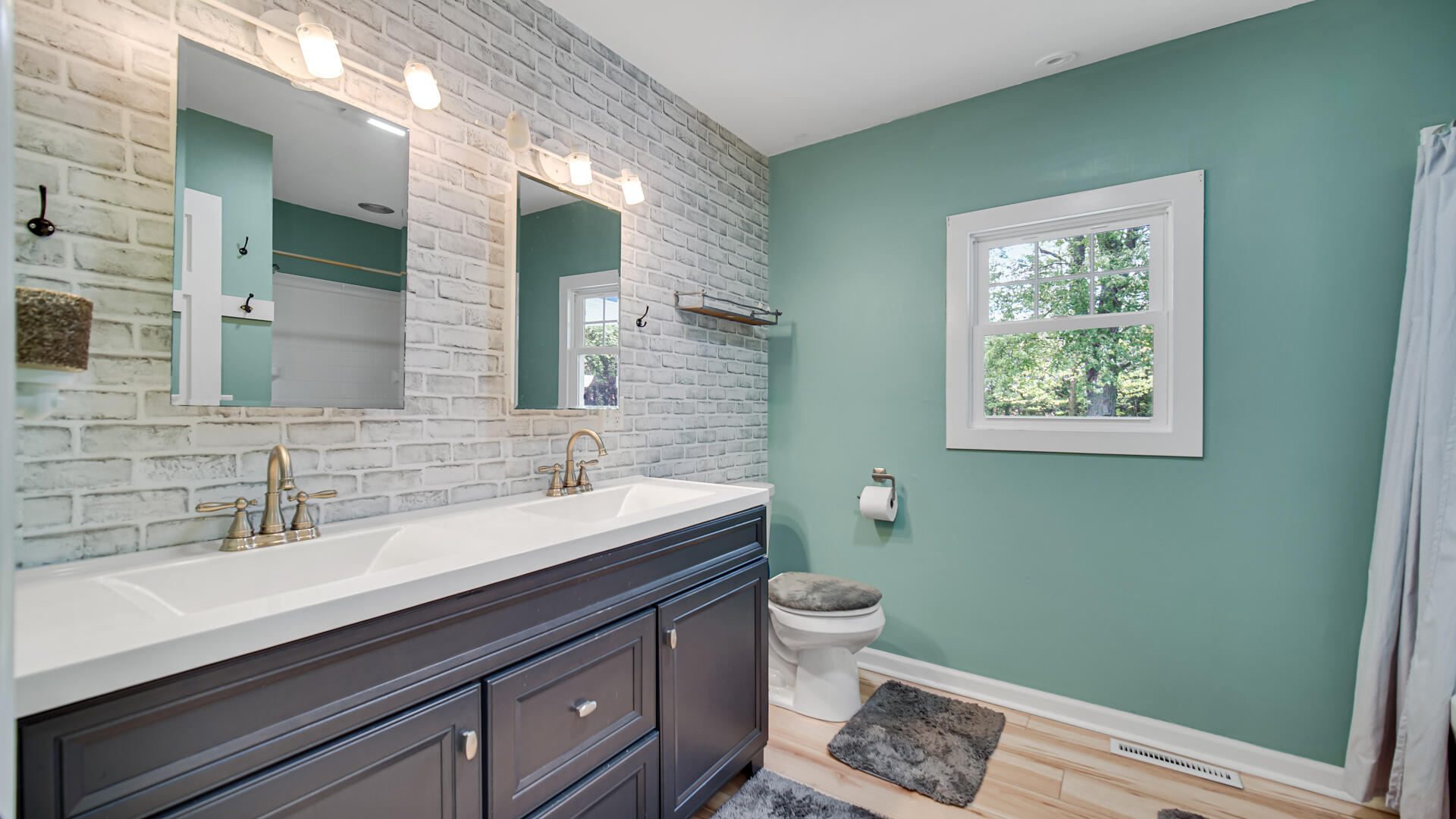 6717 State Rte 49 Rensselaer, IN 47978 - Photo 24 of 31 a bathroom with a toilet sink and mirror