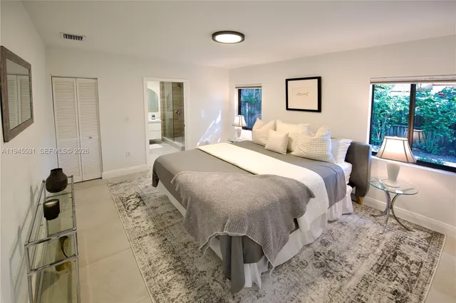 a bed room with a bed and a window