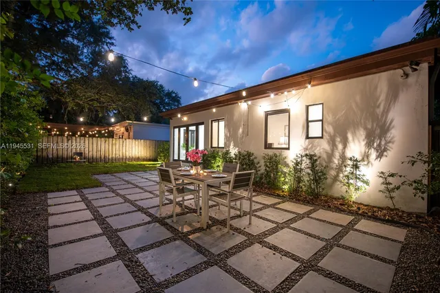 a view of backyard with a patio