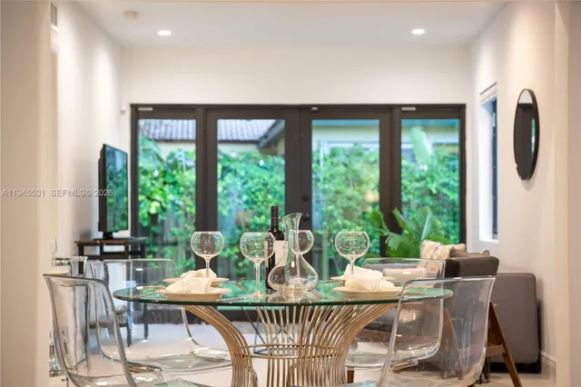 a view of a dining room with furniture window and outside view