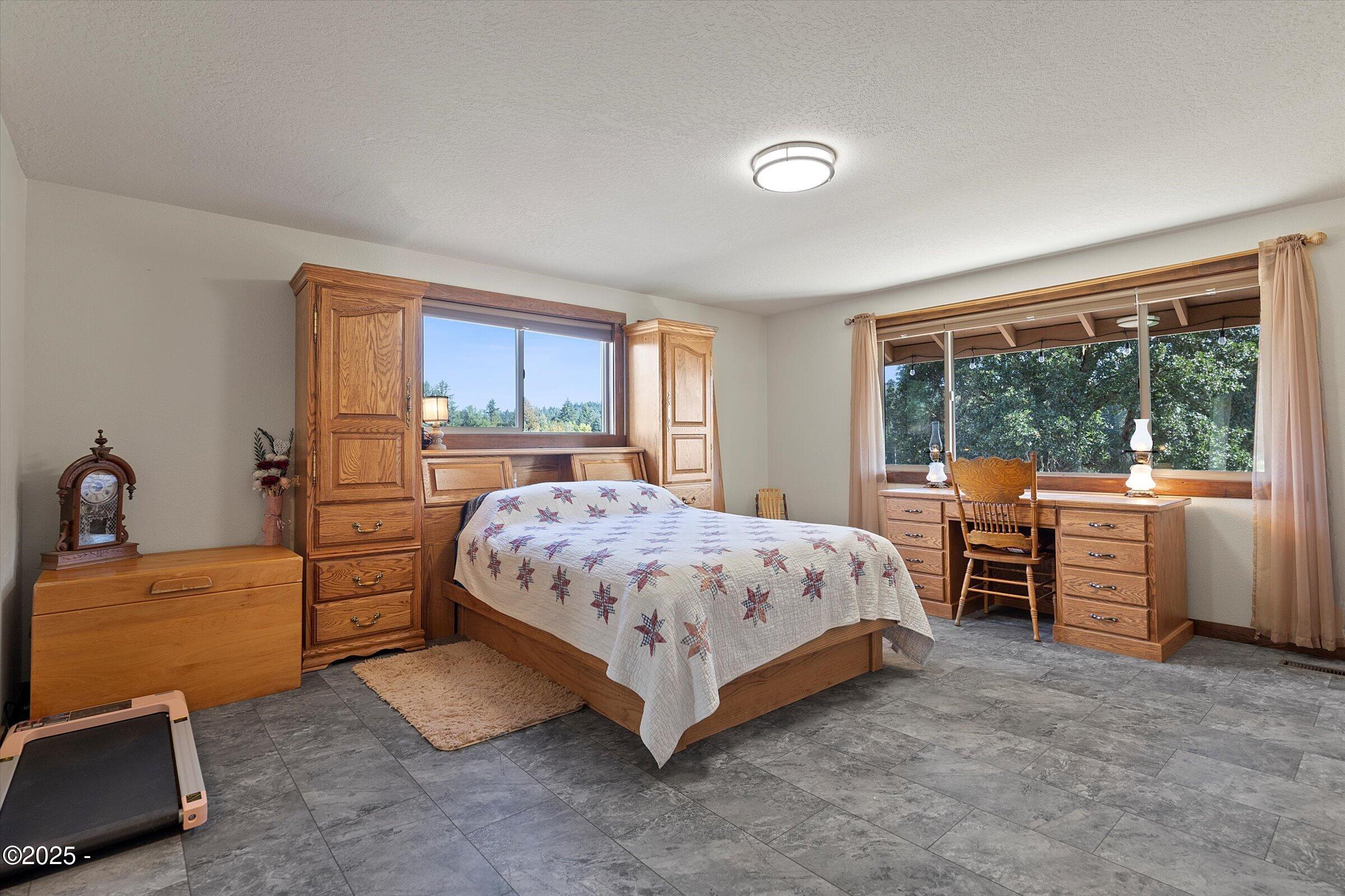 21560 Gooseneck Road Sheridan, OR 97378 - Photo 30 of 63 a bedroom with a bed and a large window