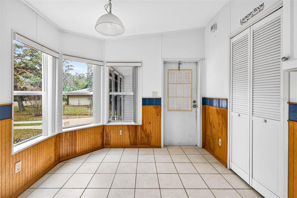6781 West Grant Street Homosassa, FL 34448 - Photo 9 of 24 a view of empty room with wooden floor and fan