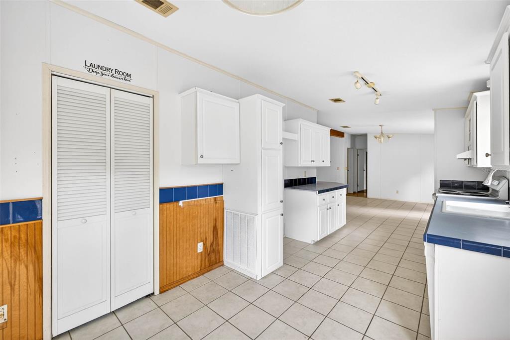 6781 West Grant Street Homosassa, FL 34448 - Photo 10 of 24 a kitchen with a refrigerator and a stove