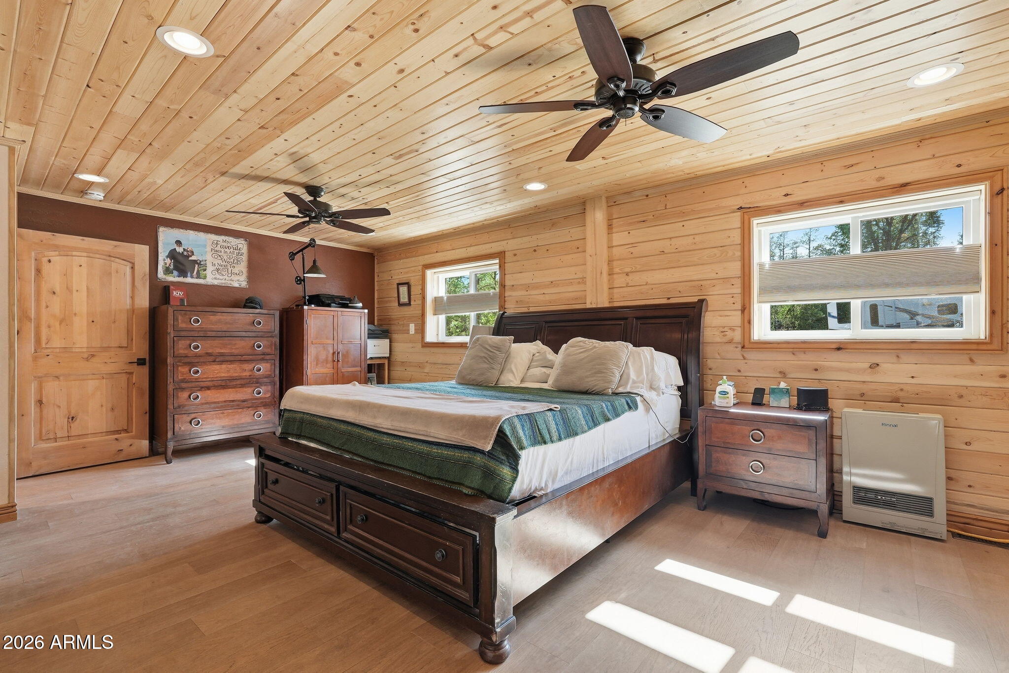 2060 Gilbert Lane Overgaard, AZ 85933 - Photo 47 of 87 a bed room with a bed and a ceiling fan