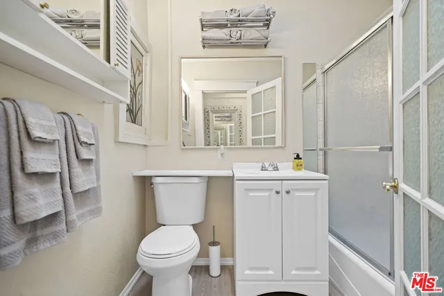 a kitchen with stainless steel appliances a stove cabinets and a sink