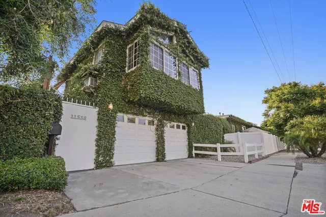 a living room with furniture a rug and a flat screen tv