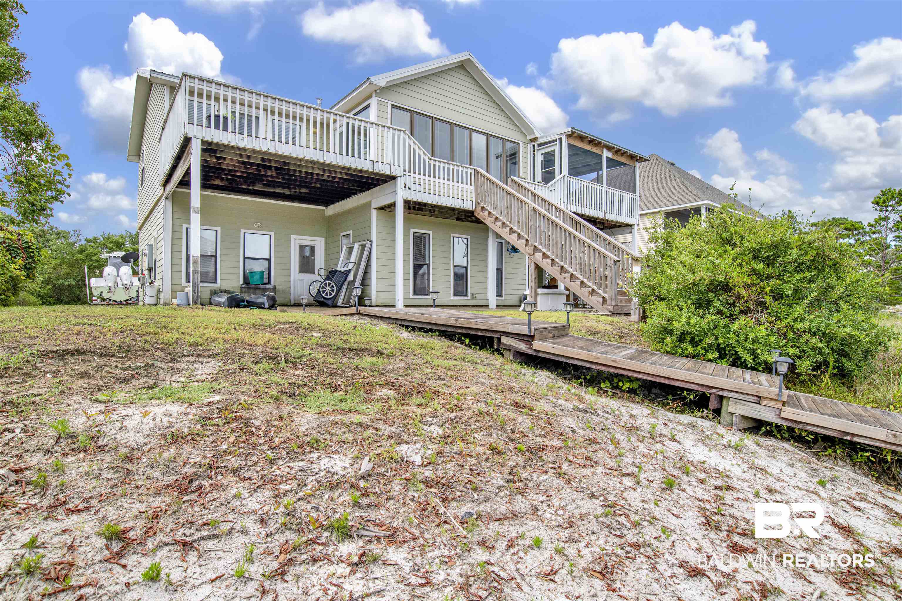 33093 River Road Orange Beach, AL 36561 - Photo 26 of 30 Rear view of house with a deck