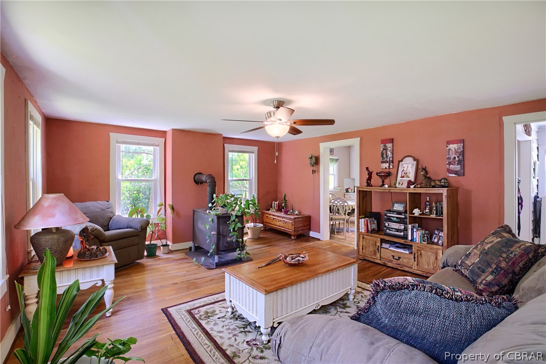 2442 Old Ferry Road Hudgins, VA 23076 - Photo 13 of 33 Living room featuring ceiling fan and light hardwood / wood-style floors