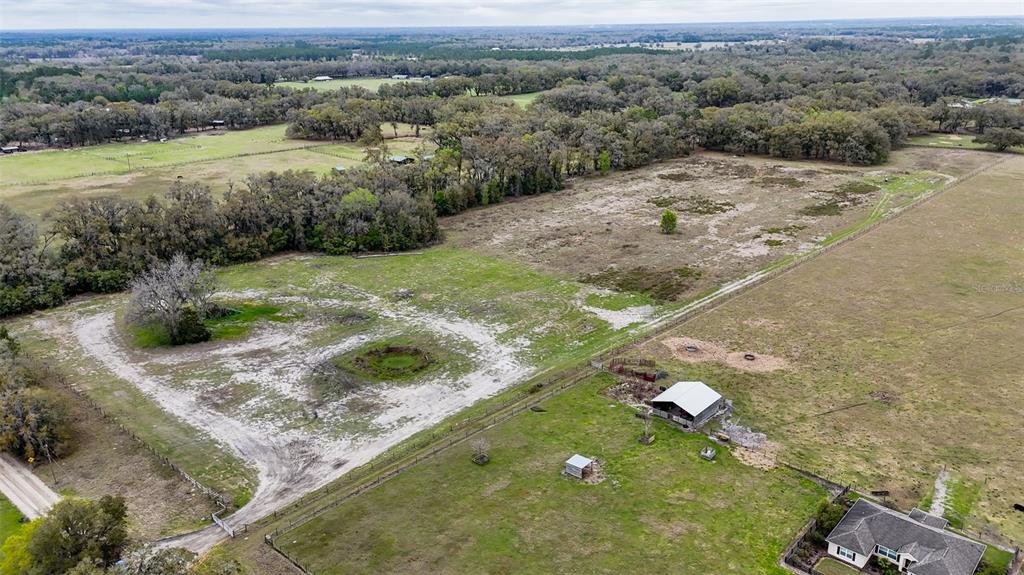 Northeast 160th Avenue Williston, FL 32696 - Photo 14 of 44 a view of a wooden floor with a yard