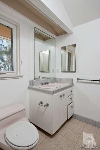 1240 Mark Avenue Carpinteria, CA 93013 - Photo 14 of 20 a bathroom with a toilet sink and mirror
