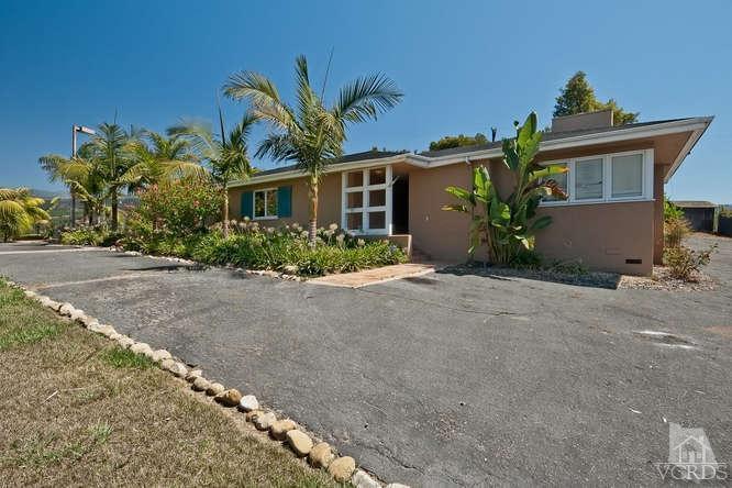 1240 Mark Avenue Carpinteria, CA 93013 - Photo 16 of 20 a front view of a house with a yard