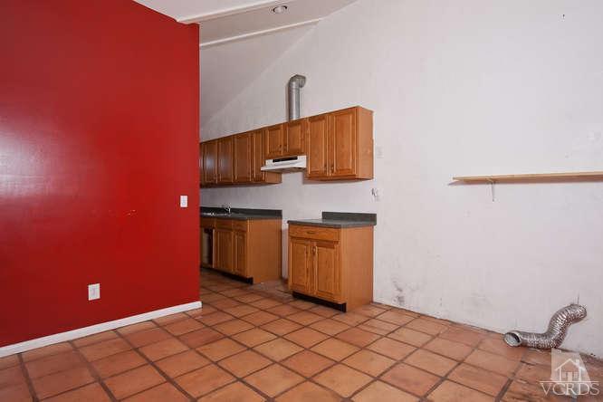 1240 Mark Avenue Carpinteria, CA 93013 - Photo 18 of 20 a kitchen with a sink and cabinets