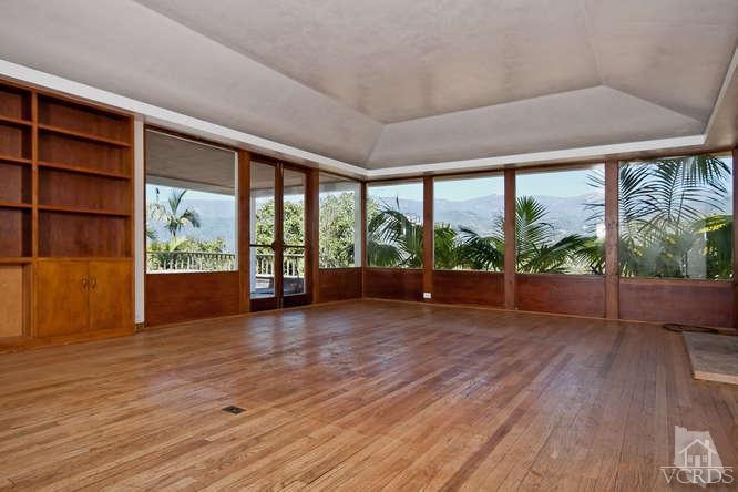 1240 Mark Avenue Carpinteria, CA 93013 - Photo 4 of 20 an empty room with wooden floor and windows